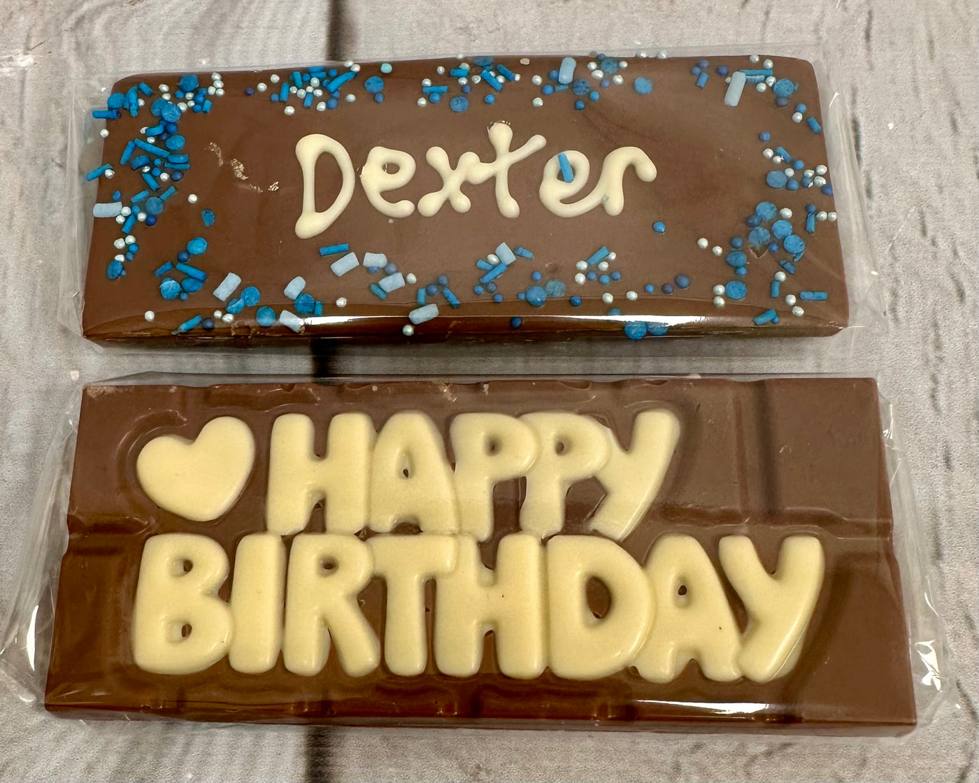 Personalised chocolate bars piped with names and Happy Birthday