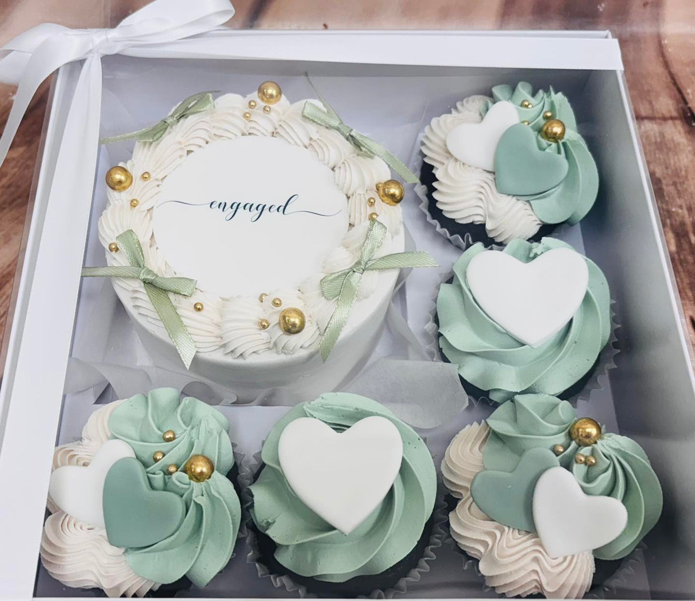 Hand-iced celebration cake and cupcakes made to order at Truffles Bakery